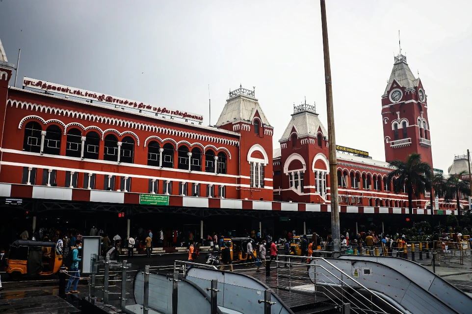 a red and white building with a clock tower